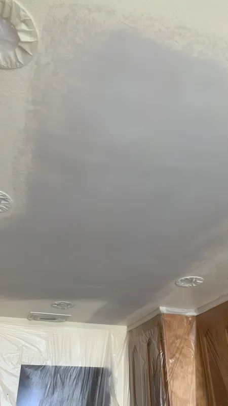 Before: ceiling patched with smooth compound, texture not yet sprayed